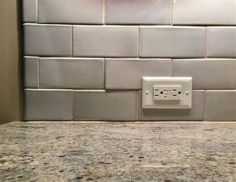 how to place backsplash tile pattern around electrical boxes|tile stove backsplash around outlet.